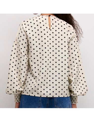 Blouse blanche à pois noirs de la marque